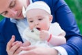 Baby girl in her dads arms portrait Royalty Free Stock Photo