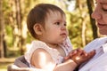 baby girl in her mother's arms clapping her hands Royalty Free Stock Photo