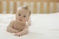 Baby girl on her stomach. Newborn baby on tummy, skin care, health care Royalty Free Stock Photo