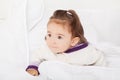 Baby girl is hiding under the white blanket Royalty Free Stock Photo