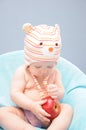 Baby girl holds organic apple Royalty Free Stock Photo