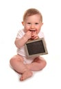 Baby girl holding blank chalkboard sign Royalty Free Stock Photo