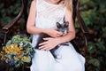 Baby girl holding hands a kitten in the light of sunset, lifestyle Royalty Free Stock Photo