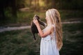 Baby girl holding hands a kitten in the light of sunset Royalty Free Stock Photo