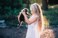 Baby girl holding hands a kitten in the light of sunset Royalty Free Stock Photo