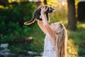 Baby girl holding hands a kitten in the light of sunset Royalty Free Stock Photo