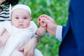 Baby girl holding her dads hand portrait Royalty Free Stock Photo