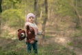 Baby girl holdong a bear toy in the outdoors Royalty Free Stock Photo