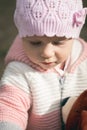 Baby girl holdong a bear toy in the outdoors Royalty Free Stock Photo