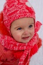 Baby girl impressed with the snow. Close-up