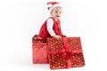 Baby Girl inside Christmas Gift Box Looking Aside Royalty Free Stock Photo