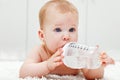 Baby girl with large water bottle Royalty Free Stock Photo