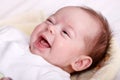 Baby girl laughing with toothless smile Royalty Free Stock Photo