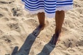 Baby girl with long hair in striped blue dress Royalty Free Stock Photo