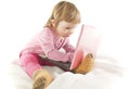Baby girl looking onto the laptop's screen Royalty Free Stock Photo