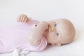 Baby girl lying on bed Royalty Free Stock Photo