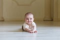 Cute 6 months Baby girl is lying on the floor Royalty Free Stock Photo