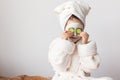 baby girl in a mask with cucumbers Royalty Free Stock Photo