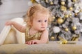 Baby girl near luxury decorated christmas tree Royalty Free Stock Photo