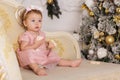 Baby girl near luxury decorated christmas tree Royalty Free Stock Photo