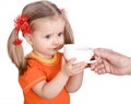 Baby girl in orange eat pear. Royalty Free Stock Photo