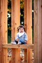 Baby girl outdoor with wood bench