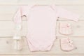 Baby girl outfit and dummies Royalty Free Stock Photo