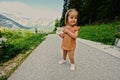 Baby girl at path to caves at Mount Krippenstein in Hallstatt, Upper Austria, Europe