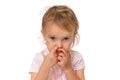 Baby girl is picking her nose with finger inside Royalty Free Stock Photo