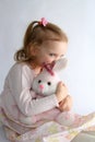 Baby girl and pink bunny