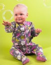 Baby girl with pink capitium and soap bubble Royalty Free Stock Photo