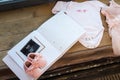 Baby girl pink dress clothes with newborn book album, body and little shoes and ultrasound scanning fetal photo