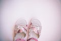 Baby girl pink sandals  on white background. Baby fashion pair pink sandals shoes for the toddlers feet Royalty Free Stock Photo