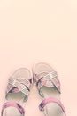 Baby girl pink sandalson white background. Baby fashion pair pink sandals shoes for the toddlers feet Royalty Free Stock Photo