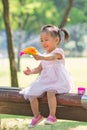 Baby girl playing bubble gun Royalty Free Stock Photo