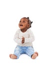 Baby girl, playing and clapping with smile in studio for applause, fun and cheerful on white background. Child, learning