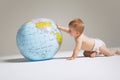 Baby Girl Playing With Globe Royalty Free Stock Photo