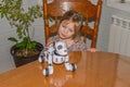 Baby girl playing robot dog video without processing