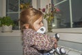 Baby girl playing robot dog video without processing