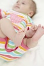 Baby Girl Playing With Toes Royalty Free Stock Photo