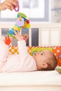 Baby girl playing with toy Royalty Free Stock Photo