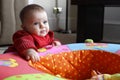 Baby girl playing with toy (playpen) Royalty Free Stock Photo