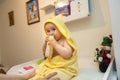 Baby girl pointing his finger straight to the camera. Cute adorable baby after bath time