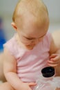 Baby girl pointing his finger straight to the camera. Cute adorable baby after bath time