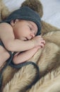 Baby girl with pompom hat sleeping Royalty Free Stock Photo