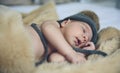 Baby girl with pompom hat sleeping Royalty Free Stock Photo