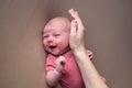 Baby girl posing for her first portrait smiling. Royalty Free Stock Photo