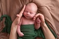 Baby girl posing for her first portrait smiling. Royalty Free Stock Photo