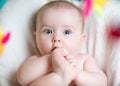 Baby girl pulling foot to mouth Royalty Free Stock Photo