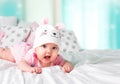 Baby girl rabbit hat empty space background. Royalty Free Stock Photo